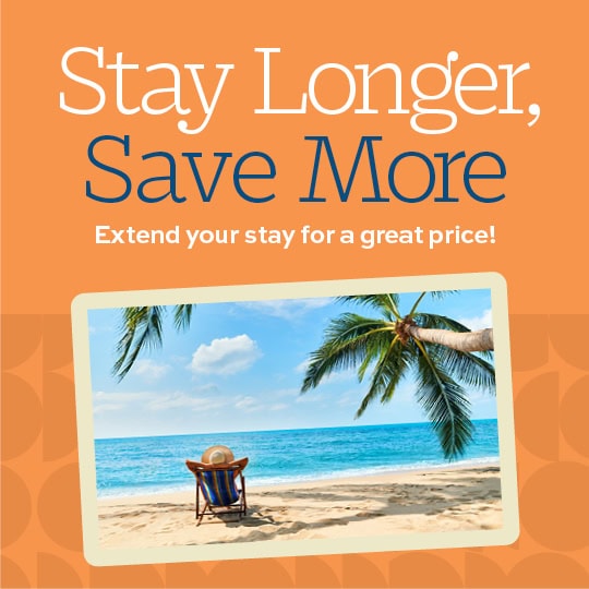 Stay Longer, Save More picture of beach with chair Stay_540x540